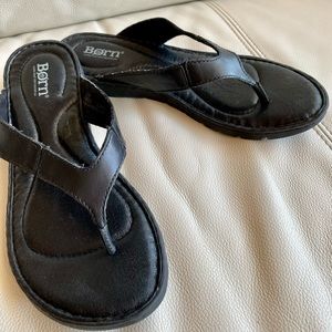 Leather, hand-crafted, cushioned sole.